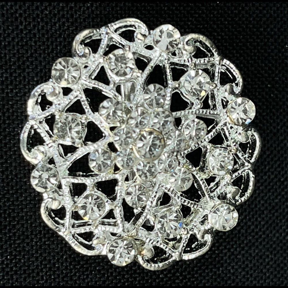 Costume Jewelry Brooch from Estate Sale. Silver colored with rhinestones.